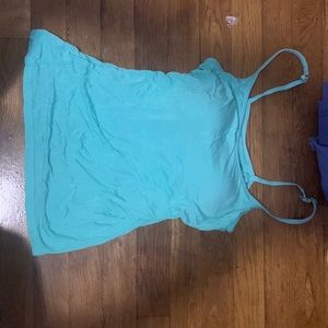 Teal tank top thin material on the body but thick & not transparent on the chest